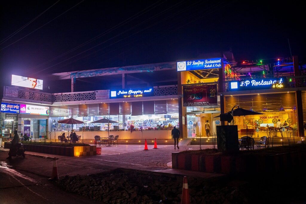 Naogaon Police Shopping Mall at night, located in Bangabaria, 2023.
