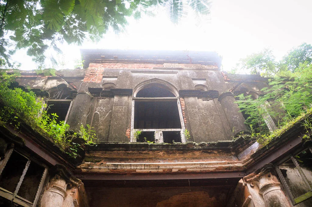 Balihar Rajbari entrance with a large broken wooden window