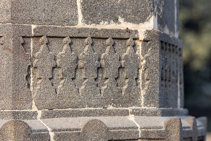 Close-up of Mosque's outer stone pillar artwork, 2023.