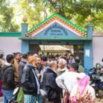 A 2022 picture of Mohadevpur town's population, as a large crowd gathers in front of a local registration complex.