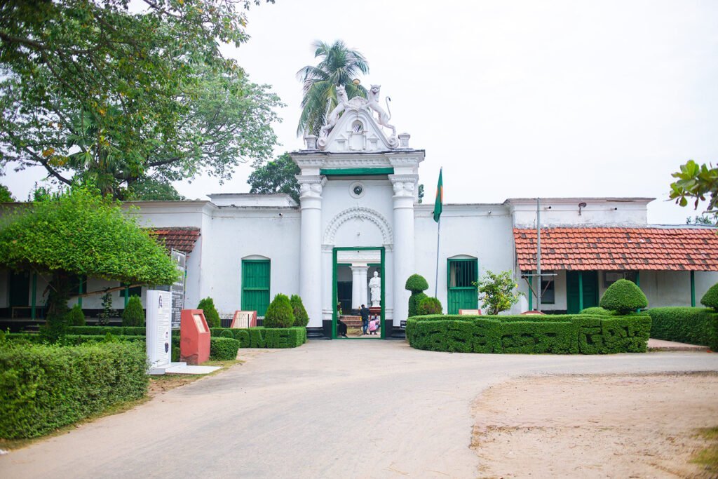 A white colored Patisar Rabindra Kachari Bari (রবীন্দ্র কাছারি বাড়ি) building in Atrai Upazila of Naogaon district. Photo taken in 2023 AD.