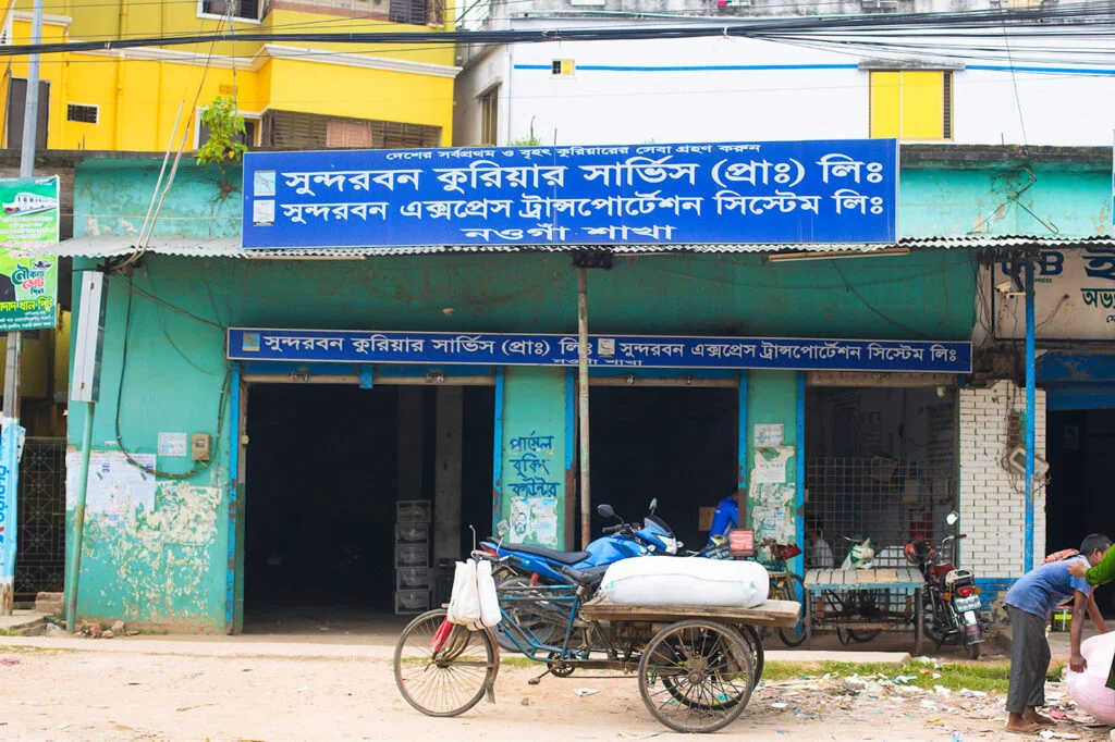 Sundarban Courier Service Naogaon branch located beside the main road at Doyaler Mor.