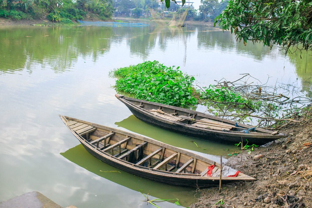 Nagor River with boats in front of Rabindra Kachari Bari at Patisar, historically used by Rabindranath Tagore.