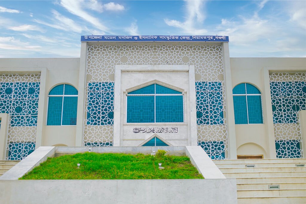 White clouds over Niamatpur Upazila Model Mosque and Cultural Center in Naogaon, 2024.